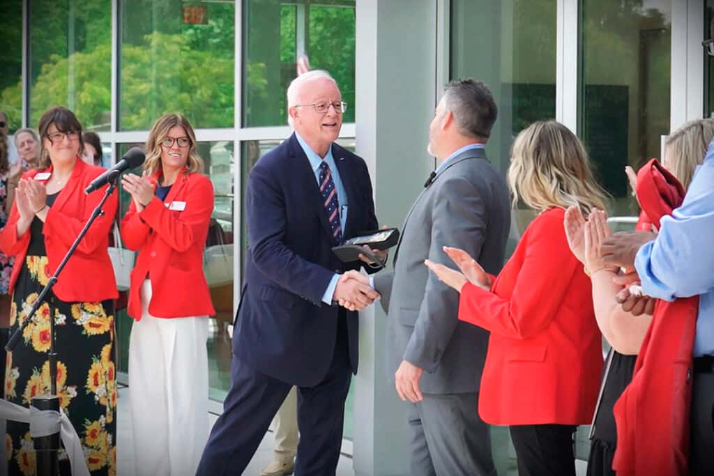 Mayor of Battle Creek presenting Mickey Seelye Key To The City