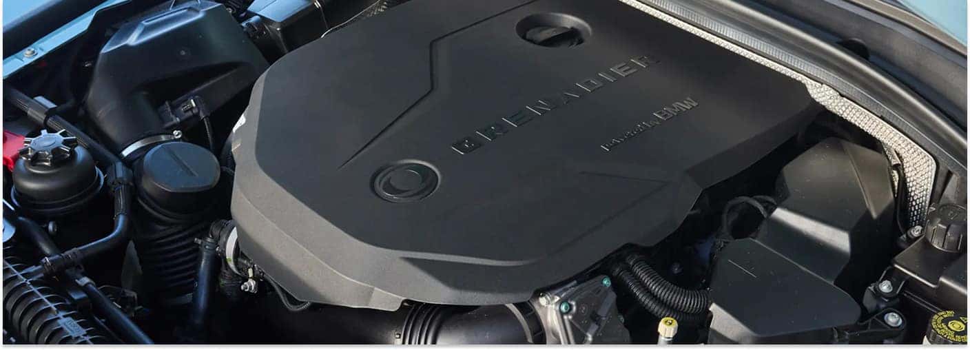 Close-up of the engine cover with "GRENADIER" text in a 2026 INEOS Grenadier Station Wagon.