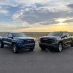 2026 GMC Canyon and 2026 GMC Sierra 1500 parked side by side in Watertown, South Dakota
