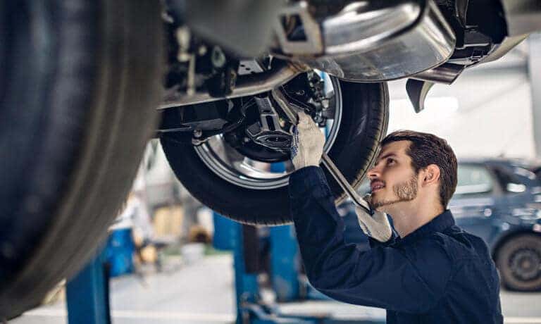 Service Technician Working Under Vehicle