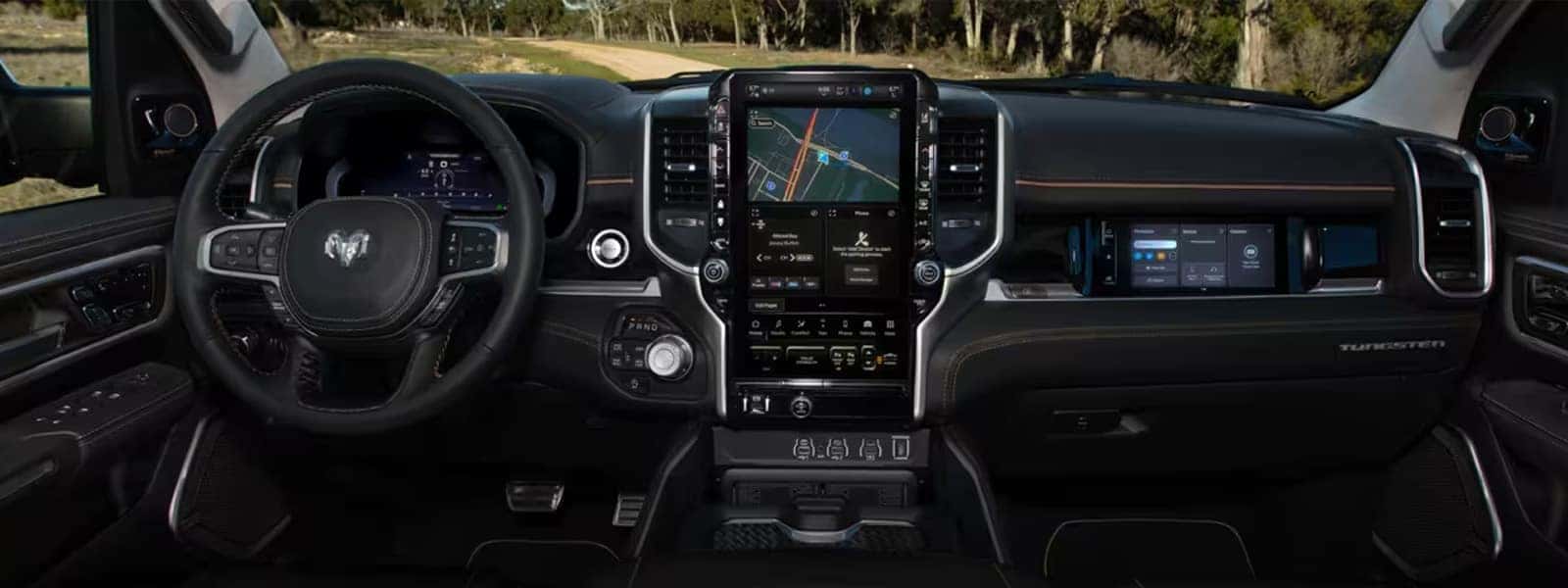 2025 Ram 1500 interior with multiple screens and Uconnect 5