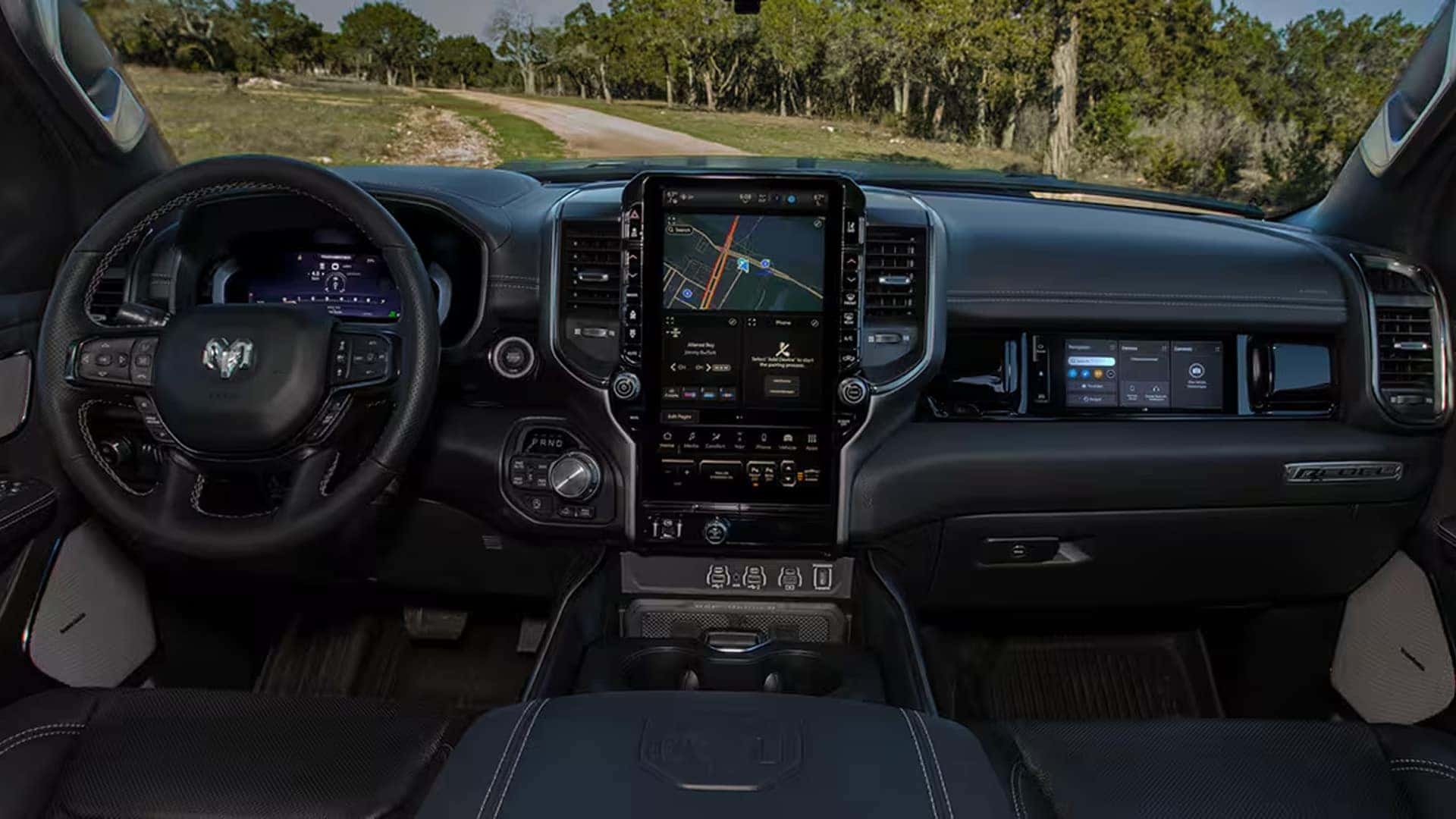 Center touchscreen, digital cluster, and passenger screen in the 2025 Ram 1500