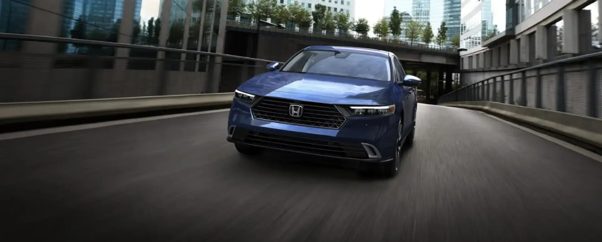 Honda Accord driving through a city underpass