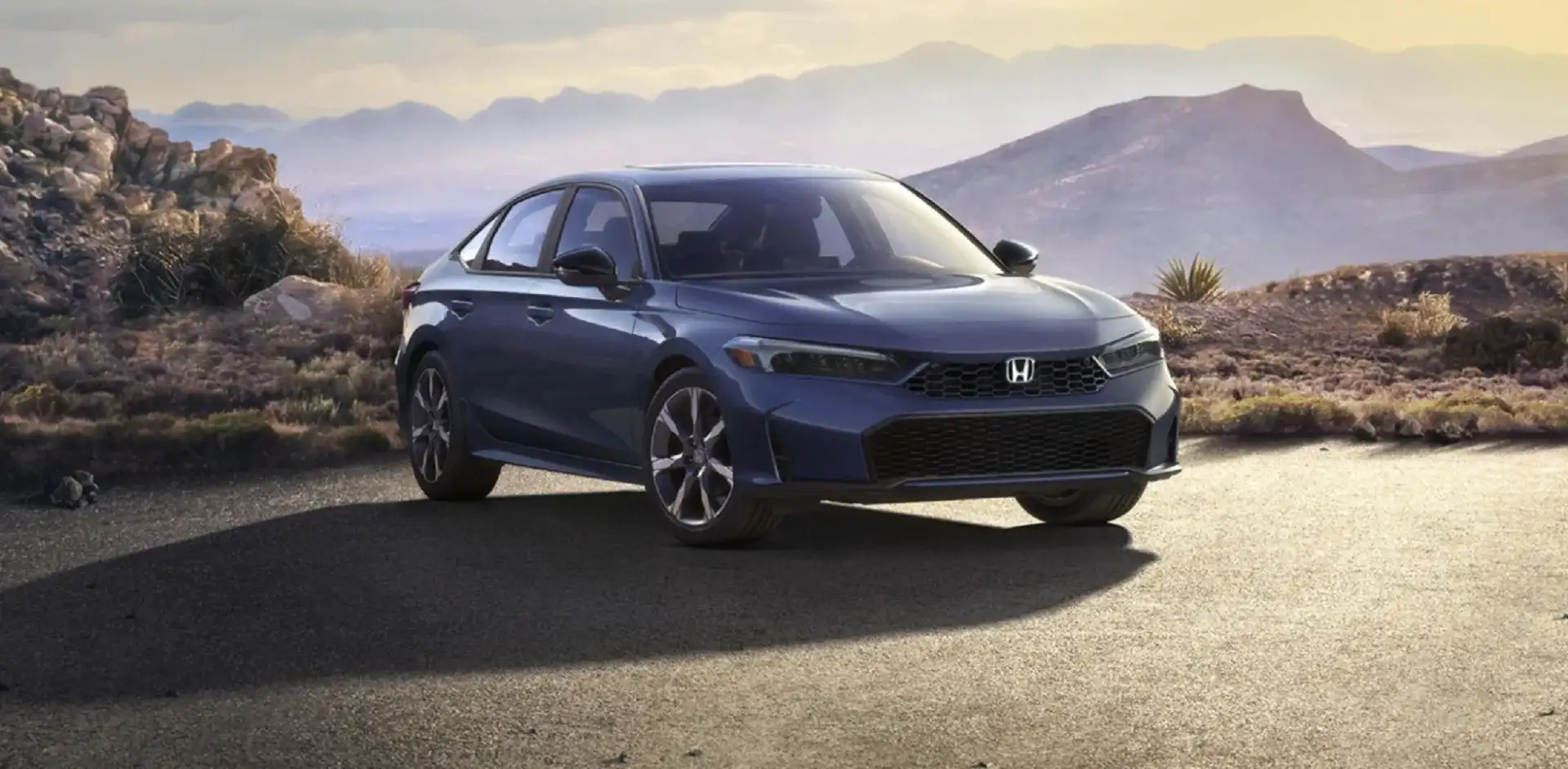The 2026 Honda Civic Hybrid Sport Touring Hybrid shown in Blue Lagoon Pearl