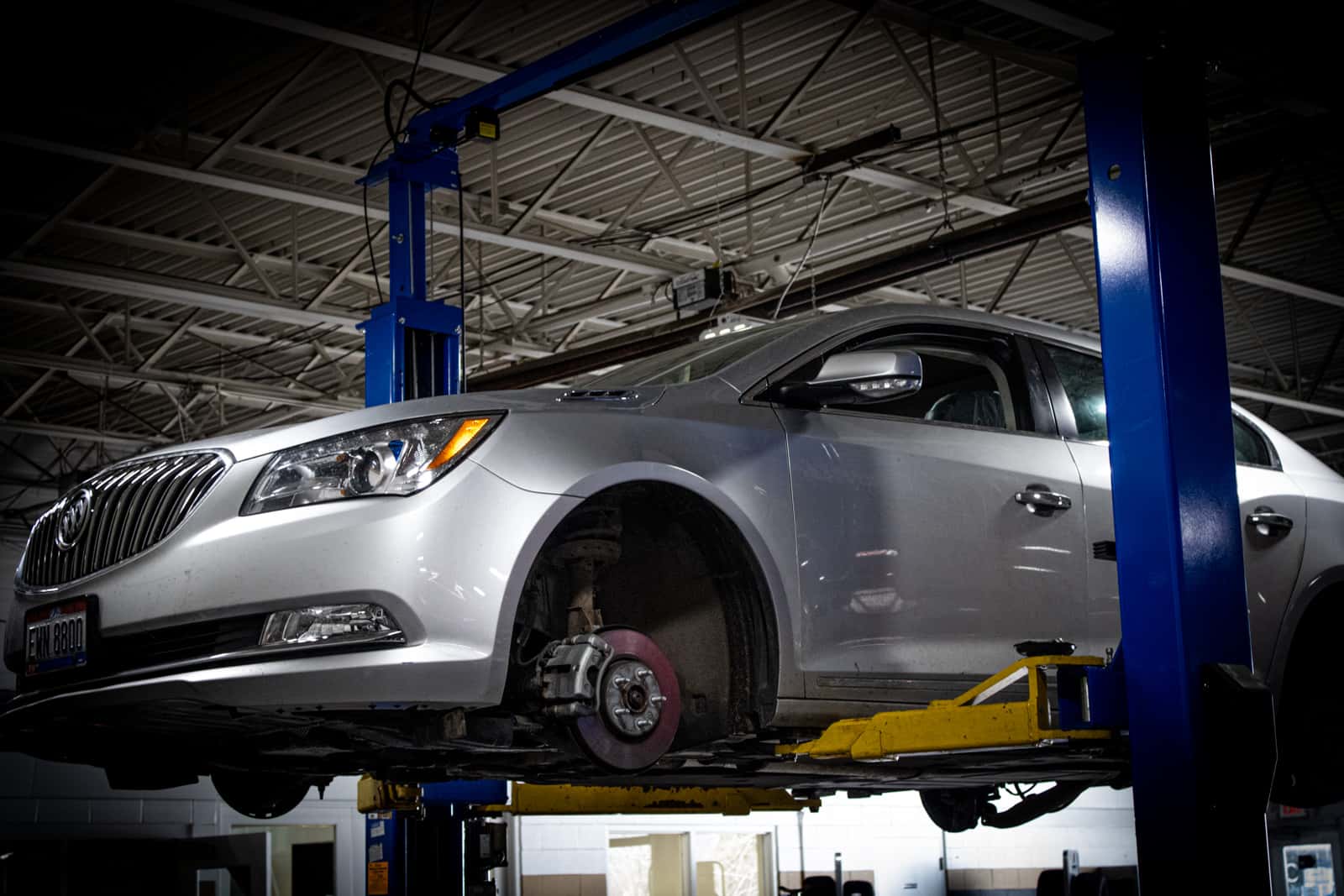 Buick vehicle on lift in Sims Auto Park service department