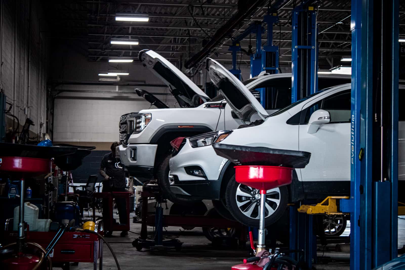Sims Auto Park service bays with vehicles on lifts
