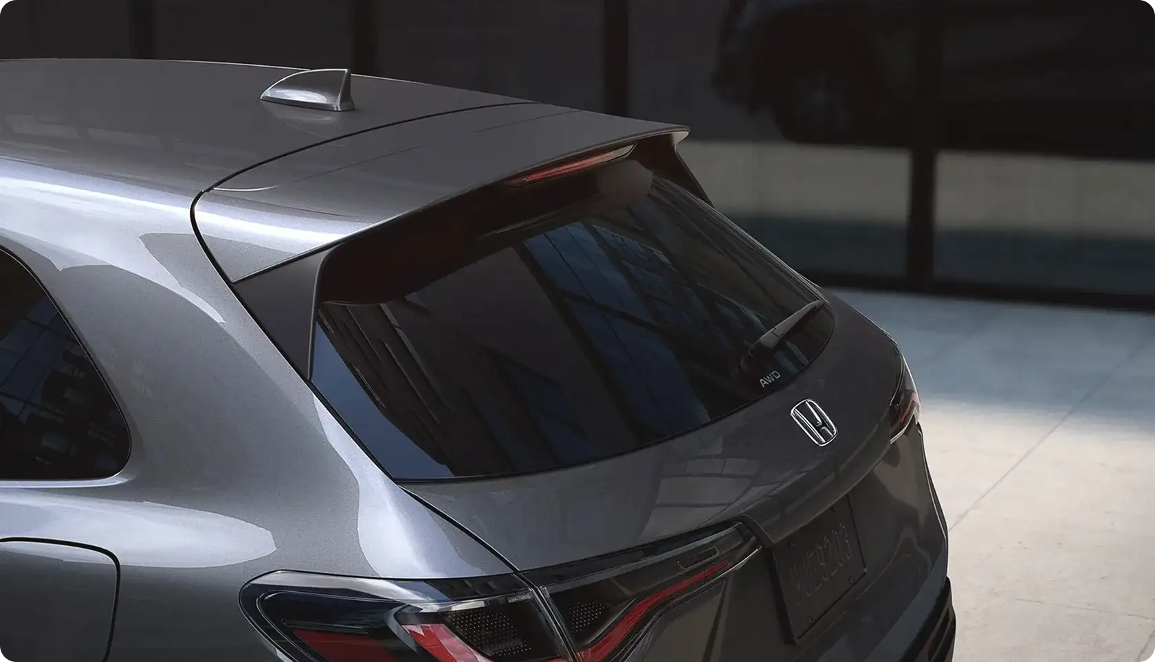 Rear of the 2027 Honda HR-V with a slim sport spoiler and LED brake lights