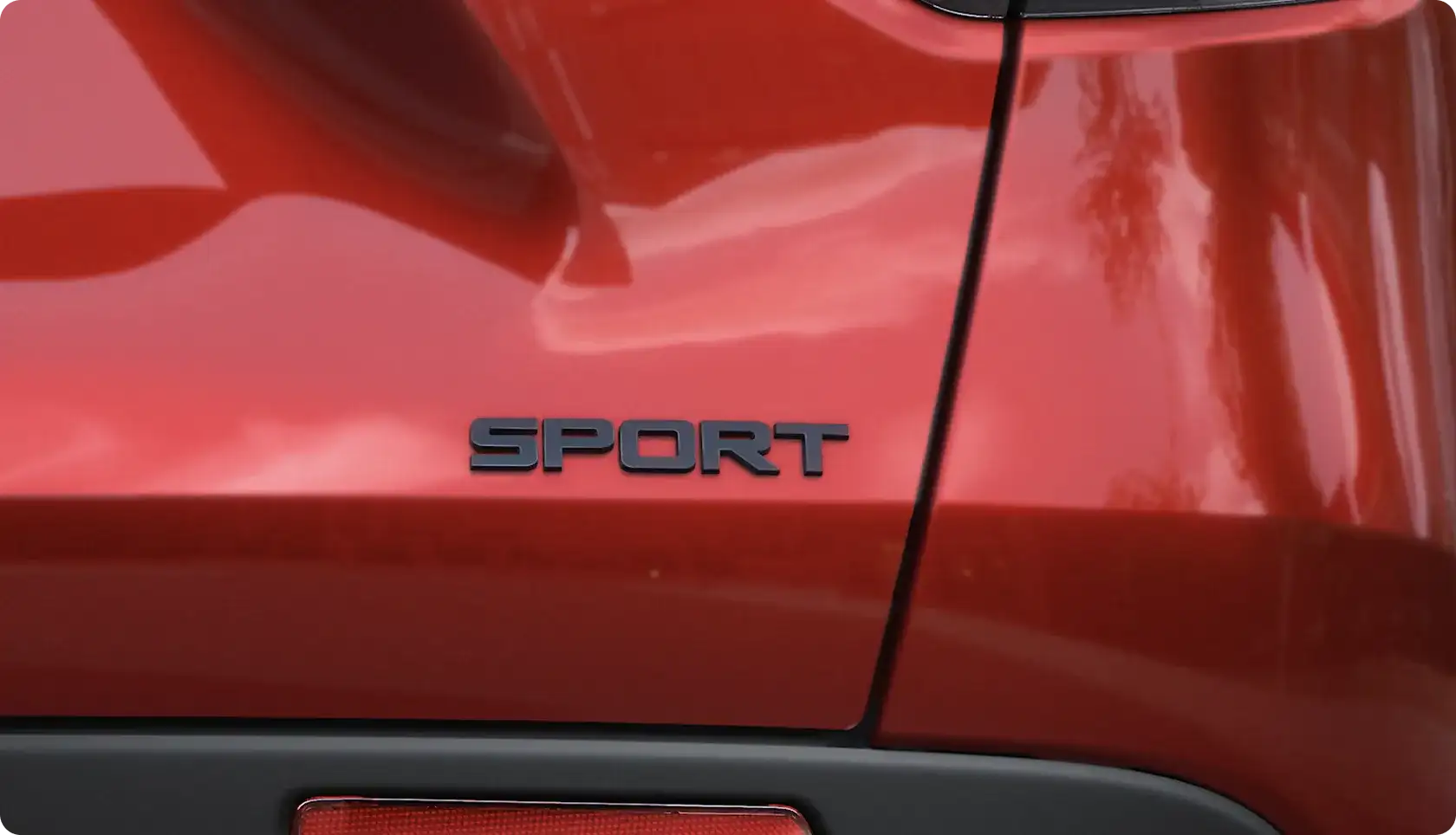 2027 Honda HR-V Sport trim with gloss-black 18-inch alloy wheels and a matte-black bumper