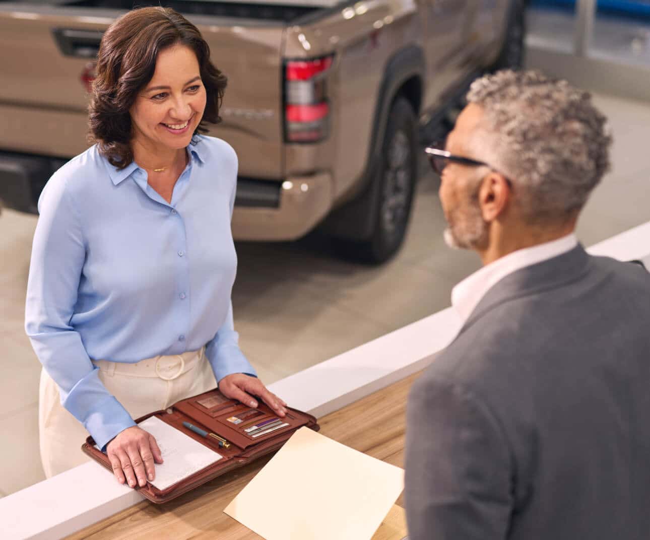 Customer talking with a Nissan sales associate