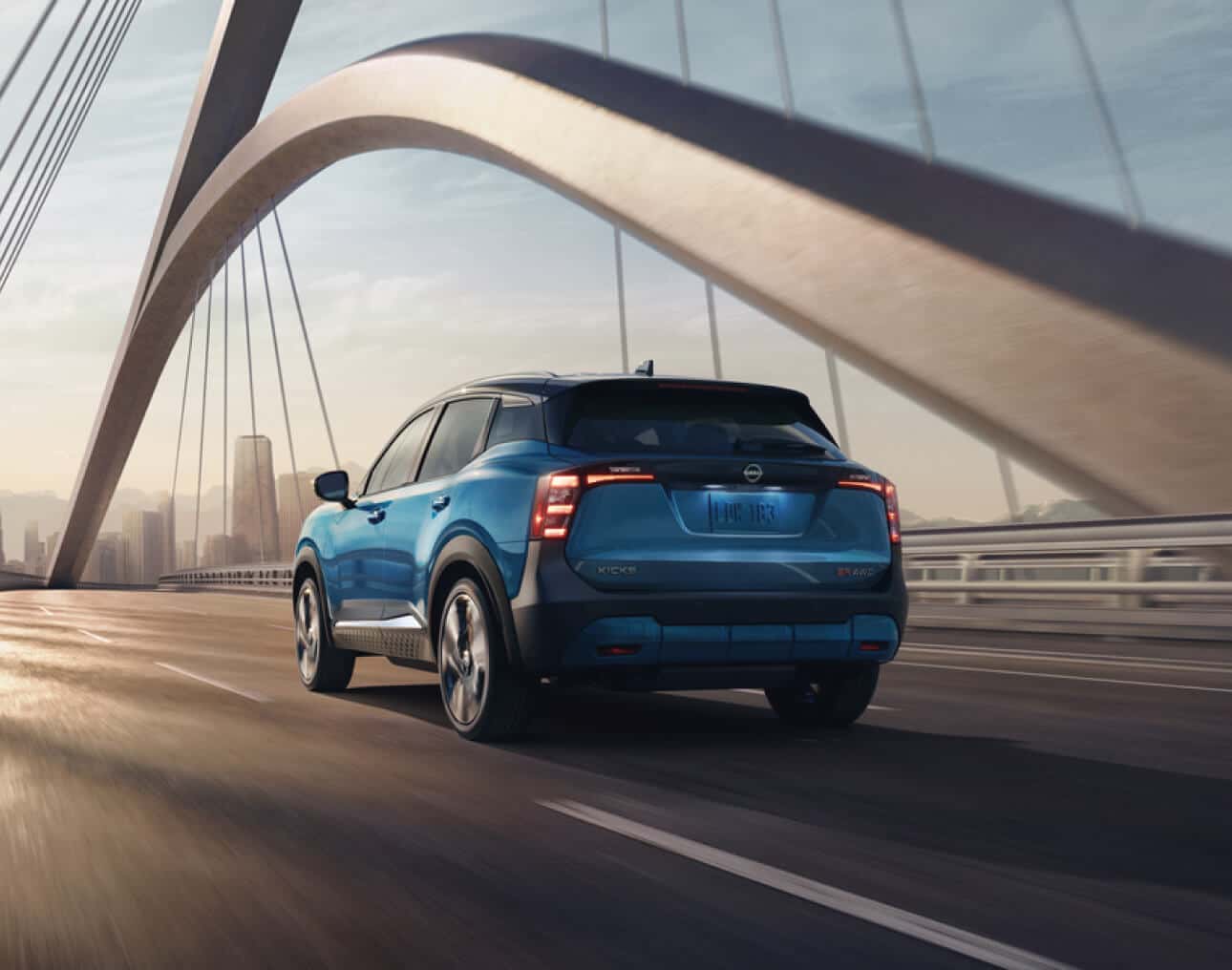 Blue Nissan SUV driving on highway