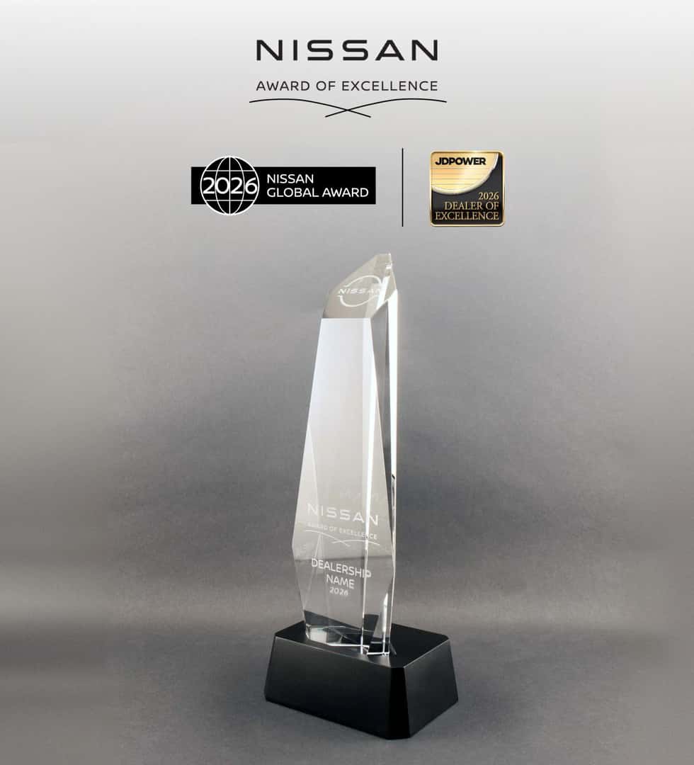 Nissan Award of Excellence trophy displayed beneath 2026 Nissan Global Award and Dealer of Excellence logos.