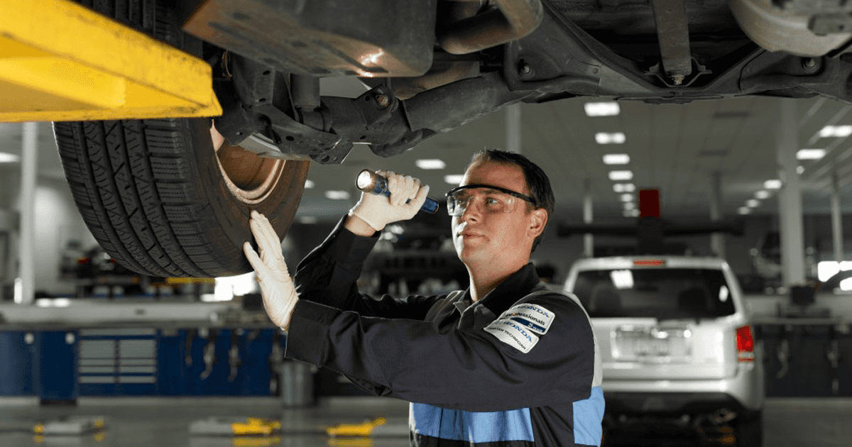 Honda tech working on vehicle