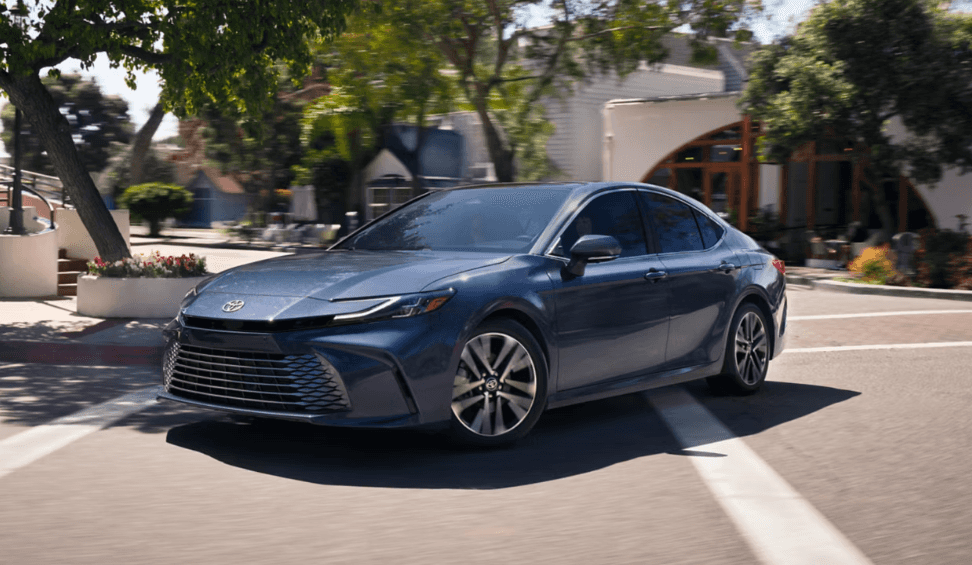 A new 2026 Toyota Camry is shown on a street.