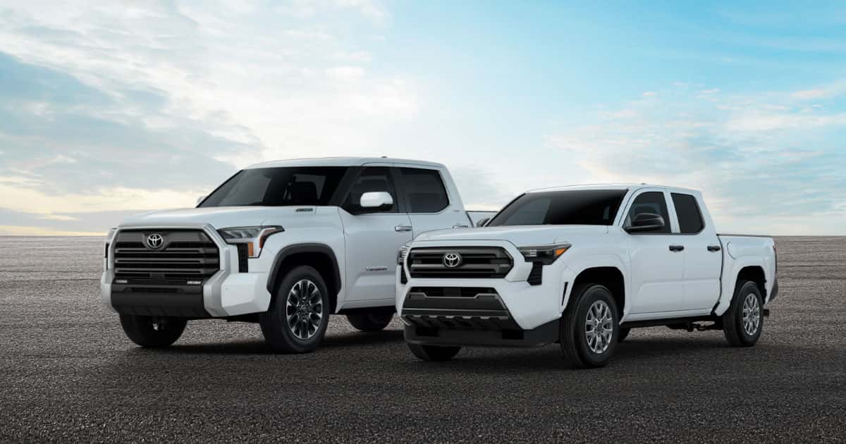 A white 2026 Toyota Tacoma alongside a white 2026 Toyota Tundra.
