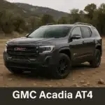 Rugged GMC Acadia AT4 SUV parked on rocky terrain with hills and trees in the background.