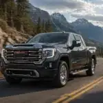 GMC Sierra driving through mountain terrain