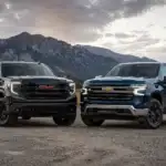 Rugged trucks against a mountain backdrop