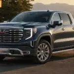 GMC truck at golden hour with nature backdrop