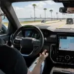Modern vehicle interior on a coastal drive