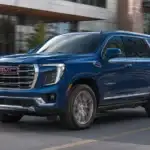 Blue GMC Yukon Driving Downtown