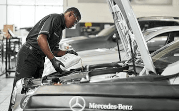 Technician Filling Engine Oil