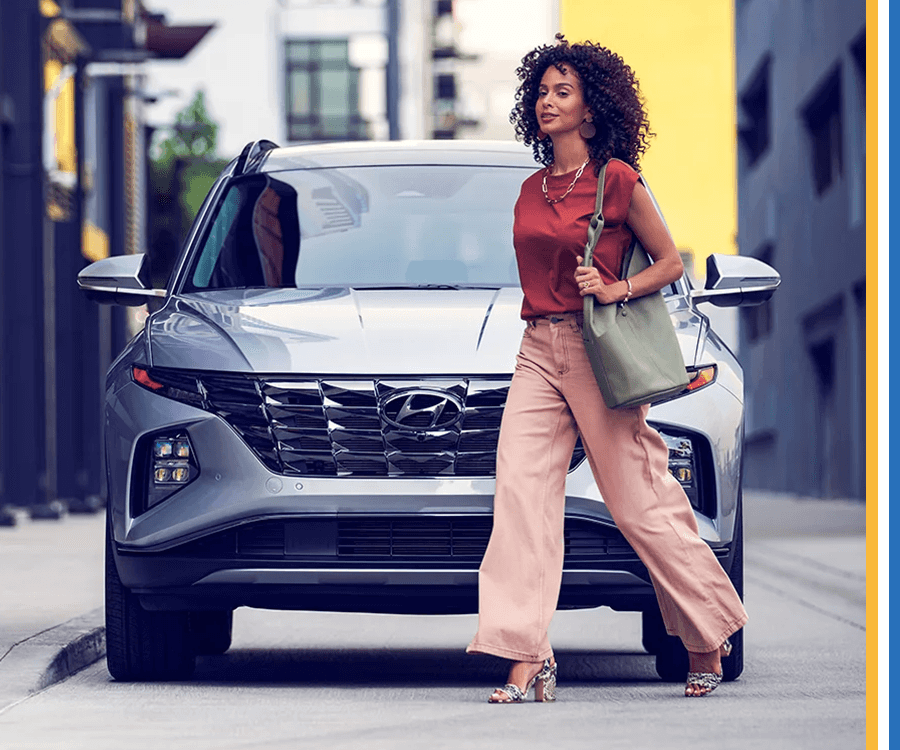 Woman walking in front of car