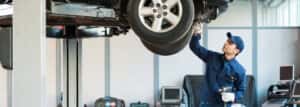 Generic mechanic working underneath vehicle