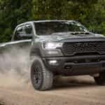 Ram 1500 driving down a dirt road