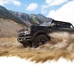 2026 Ford Bronco throwing sand in the dunes
