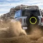 2026 Ford Bronco RTR From the rear driving through a dirt road
