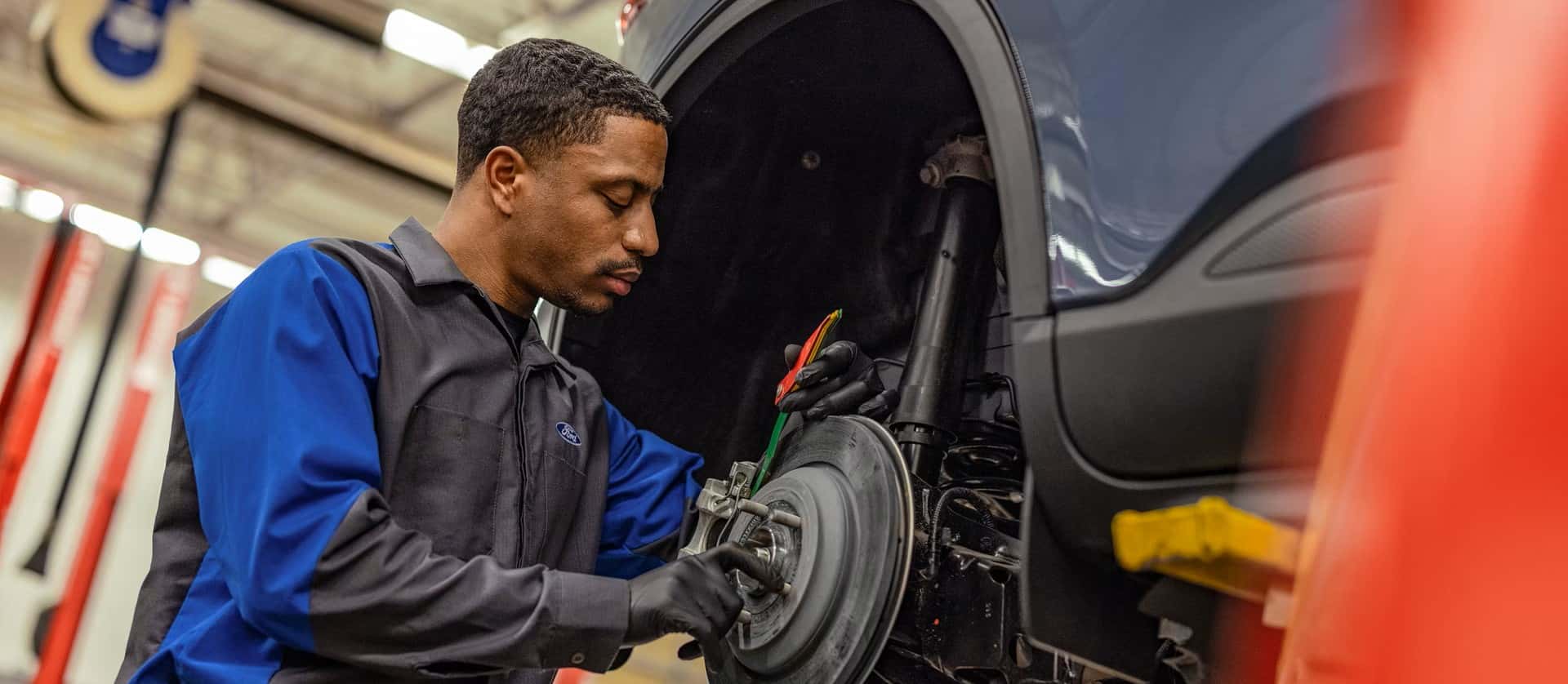 A mechanic working on a car at our Montgomery repair shop