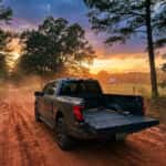 2026 Ford F-150 parked on an Alabama red-clay road at dusk