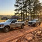 2026 Ford F-150 and 2026 Ford Ranger side by side on a central Alabama red-clay road