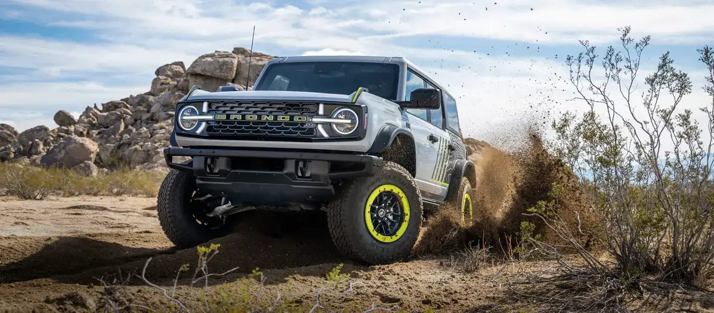 2026 Ford Bronco RTR From the front driving through a dirt road