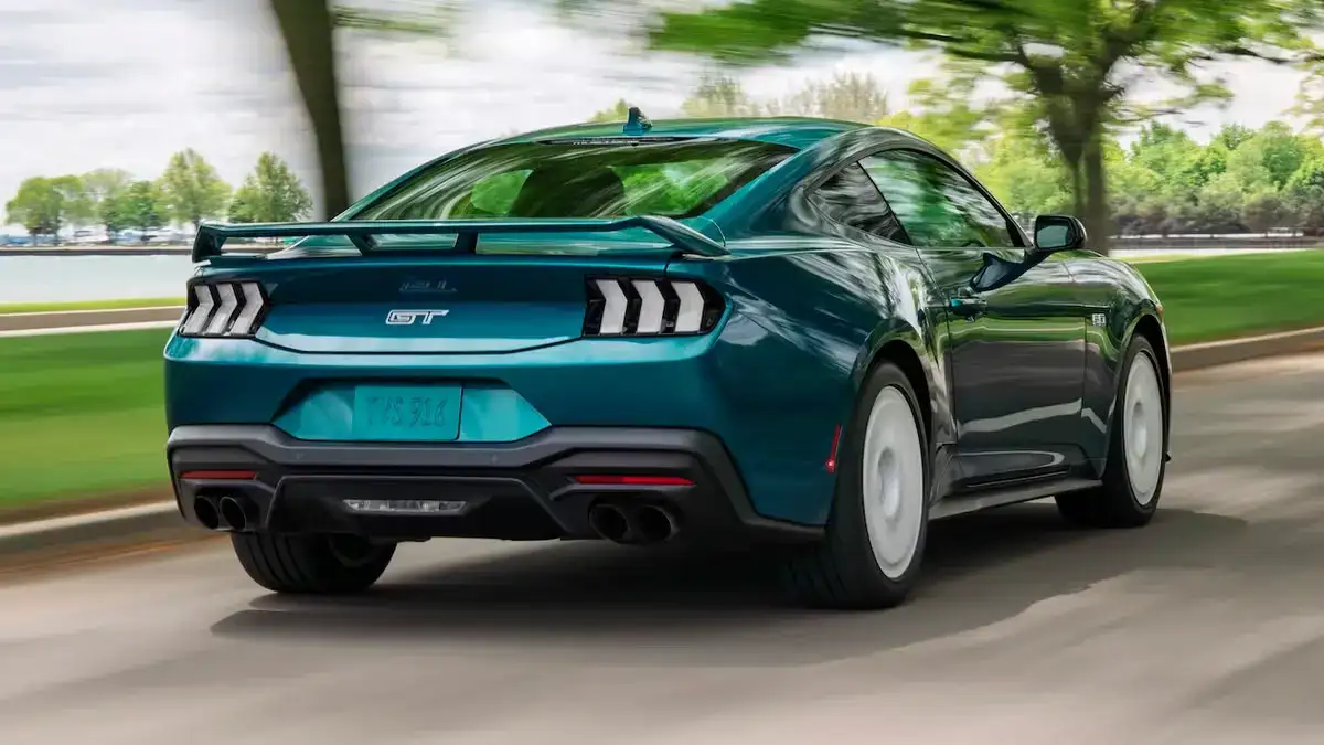 2026 Ford Mustang® Fastback in teal driving down the road