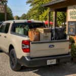 2026 Ford Maverick bed loaded with farmers market produce and tote bags at a Fayetteville GA outdoor market
