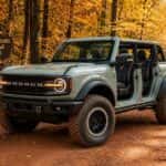 2026 Ford Bronco four-door on a Georgia gravel forest road in fall foliage