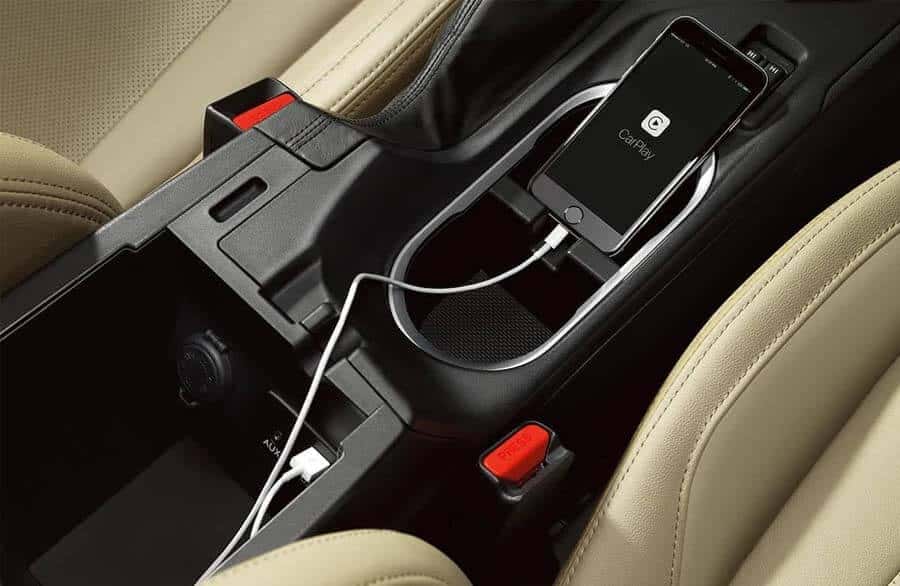 A cell phone in center console pairing to Bluetoot