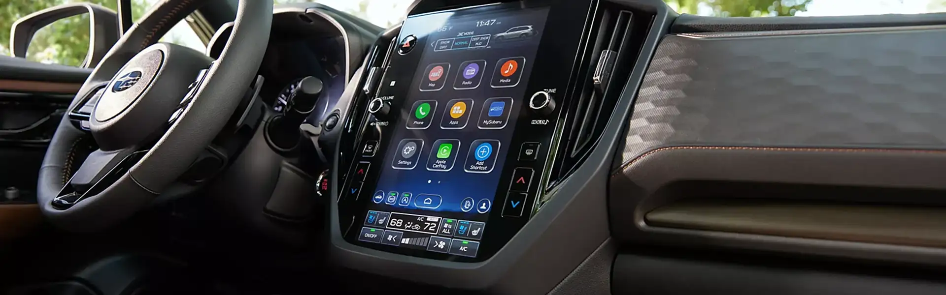 Dashboard of the 2026 Subaru Forester with the 11.6-inch vertical touchscreen and two-tone brown interior
