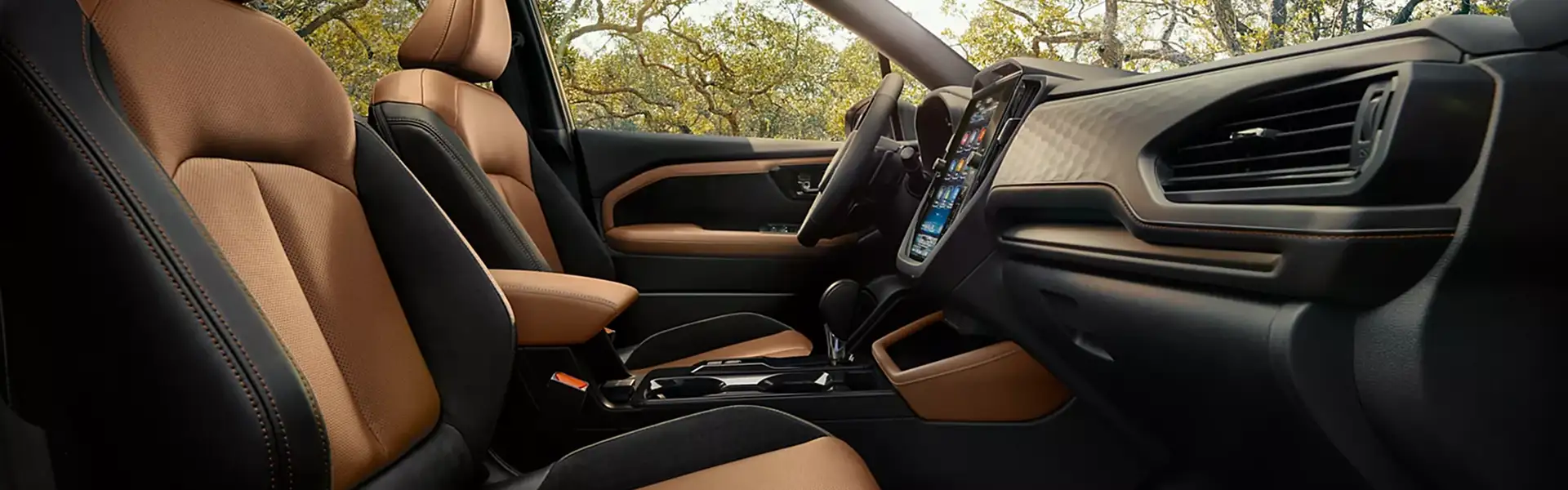 Front seats and dashboard of the 2026 Subaru Forester in two-tone tan and black leather