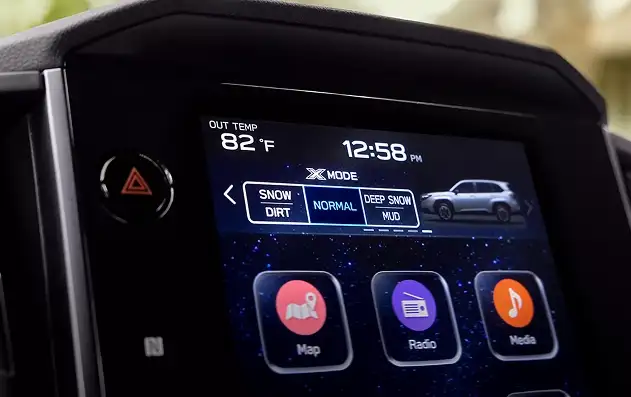 Close-up of the 2026 Subaru Forester touchscreen showing X-MODE Snow/Dirt and Deep Snow/Mud settings