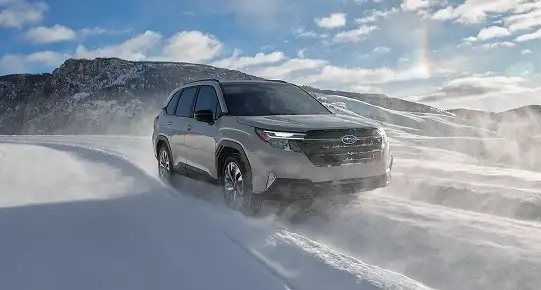 Silver 2026 Subaru Forester driving through deep snow
