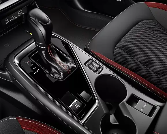 Center console and gear shifter of the 2026 Subaru Impreza with red-accented seats