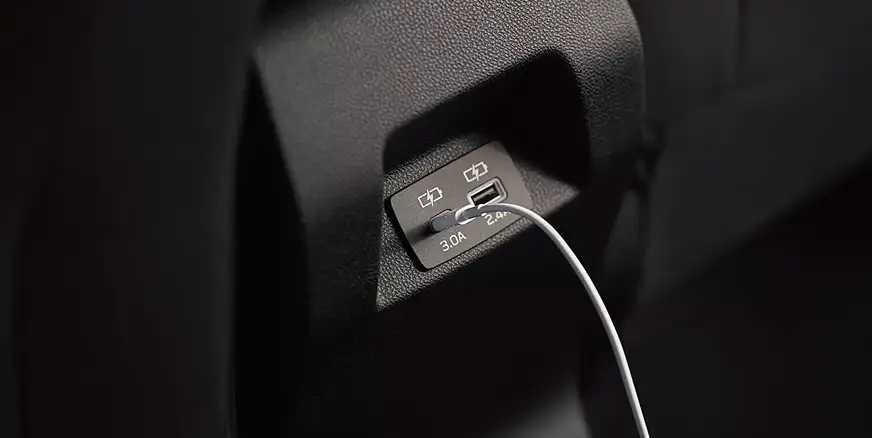 USB-A and USB-C charging ports in the 2026 Subaru Impreza with a cable plugged in