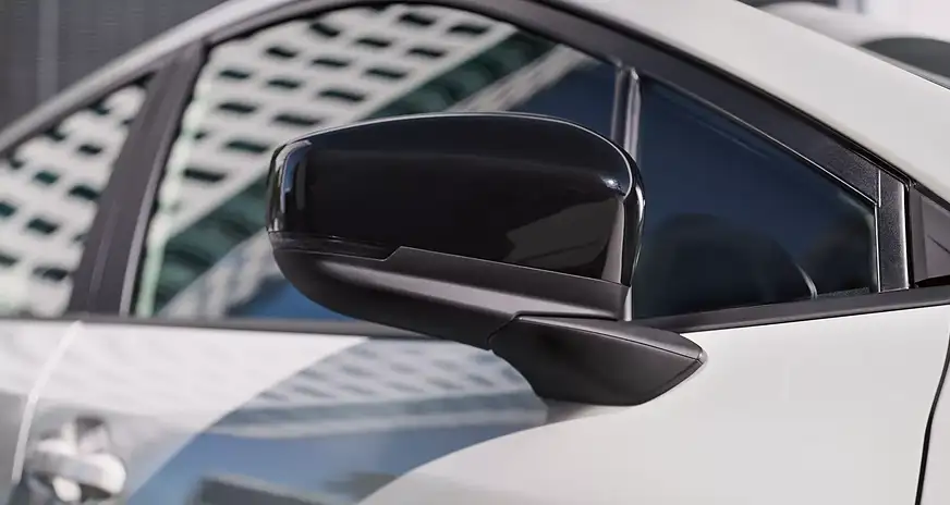 Close-up of the side mirror on a white 2026 Subaru Impreza