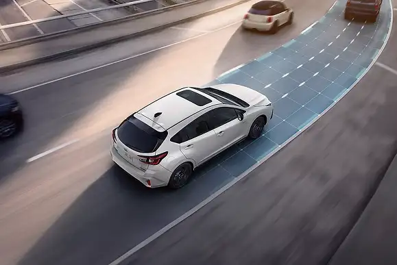 Overhead view of a white 2026 Subaru Impreza using adaptive cruise control to keep distance behind traffic