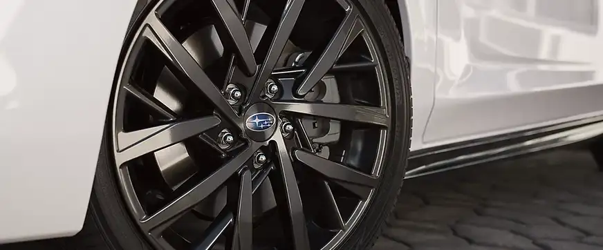 Close-up of an 18-inch dark gray-finish alloy wheel on the Impreza RS