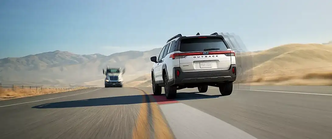 2026 Subaru Outback driving a highway with advanced safety technology