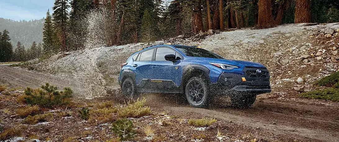 2026 Subaru Crosstrek driving on a back road