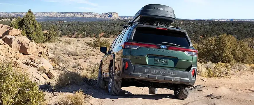 2026 Subaru Outback climbing rough terrain with X-MODE